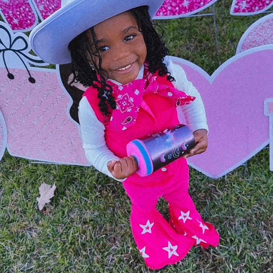 Kailani is registered to the contest to win money with this photo: child, clothing, costume, dress, face, female, girl, grass, hat, head, lawn, nature, outdoors, park, person, photography, plant, portrait, purple, sunhat