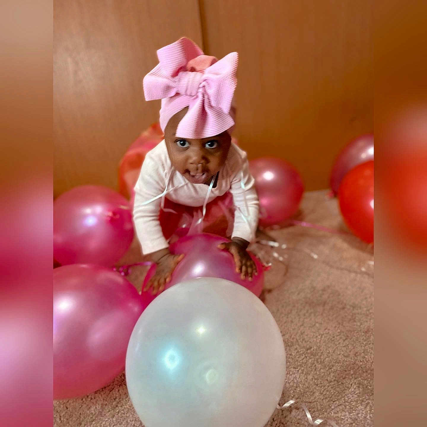Carmyn is registered to the contest to win money with this photo: balloon, beauty, child, event, fun, happy, magenta, material_property, organ, party, party_supply, peach, pink, recreation, smile, sweetness, toddler, toy