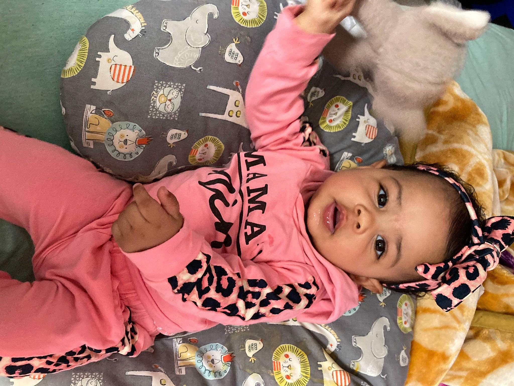 Zamara is registered to the contest to win money with this photo: arm, baby, baby_products, baby_toddler_clothing, beauty, cheek, child, facial_expression, finger, happy, mammal, pattern, person, room, skin, sleeve, smile, textile, toddler, toy
