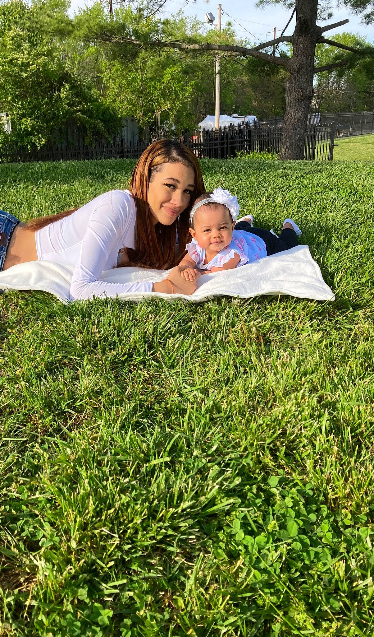 Zamara joined the competition — help win amazing prizes! baby, child, face, grass, grass_family, grassland, happy, joy, landscape, lawn, leisure, meadow, people_in_nature, person, plant, prairie, recreation, shirt, sitting, t_shirt