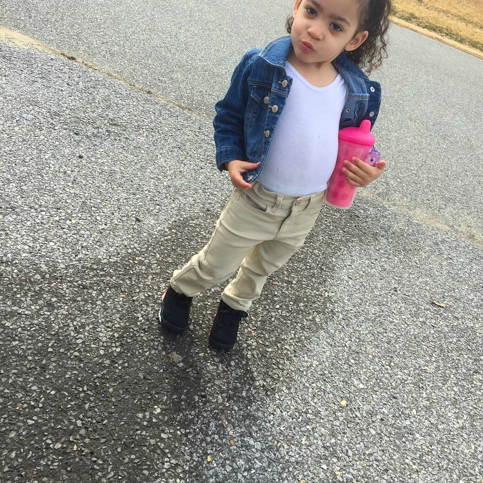 Samiyah is registered to the contest to win money with this photo: asphalt, child, denim, dress, footwear, fun, jeans, knee, leg, outerwear, person, photography, play, recreation, road_surface, shoe, smile, snapshot, standing, toddler