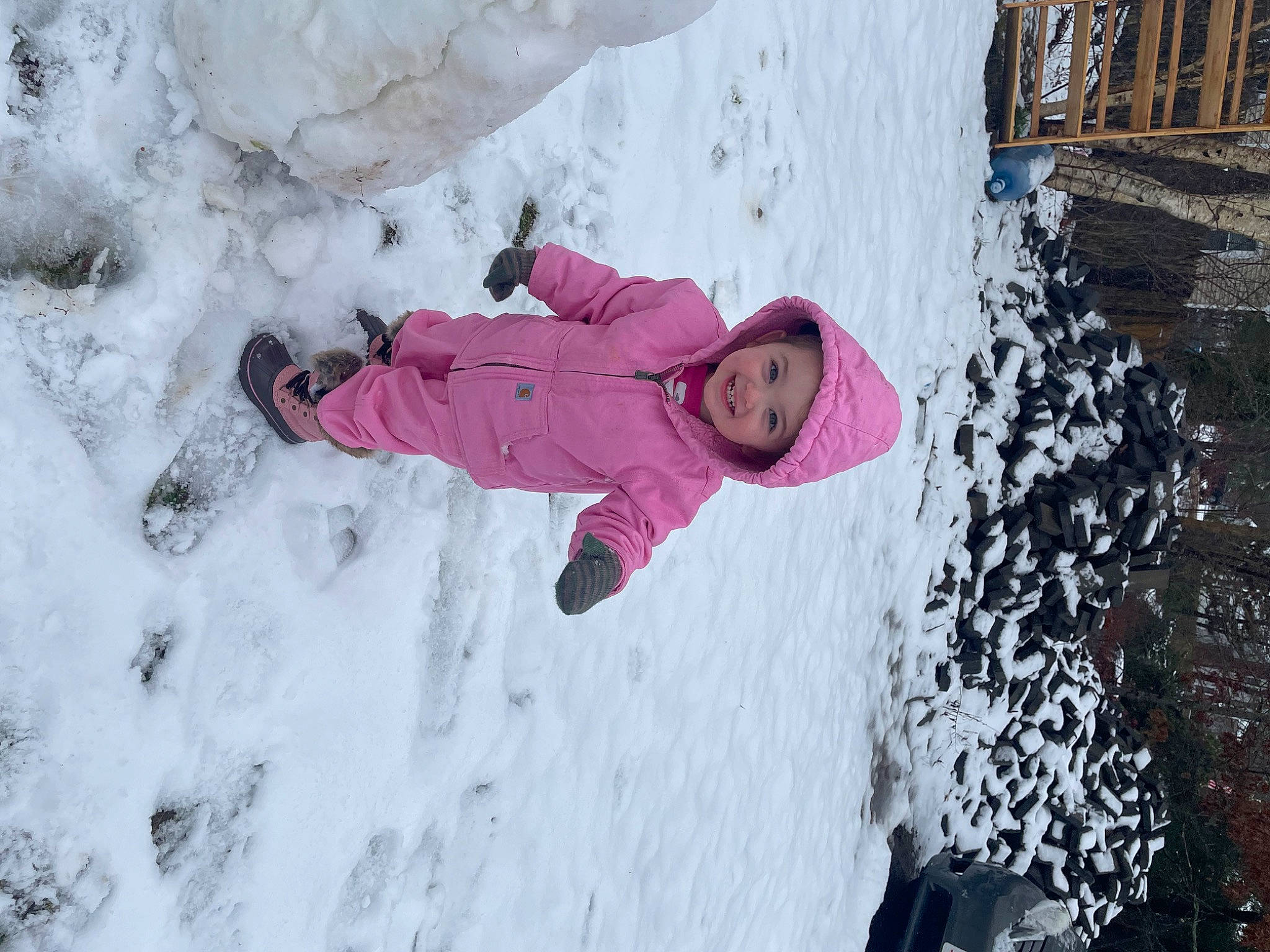 Malani is registered to the contest to win money with this photo: adventure, baby_toddler_clothing, child, freezing, fun, geological_phenomenon, glacial_landform, glove, headwear, ice_cap, jacket, joy, leisure, magenta, parka, person, plant, recreation, slope, snow
