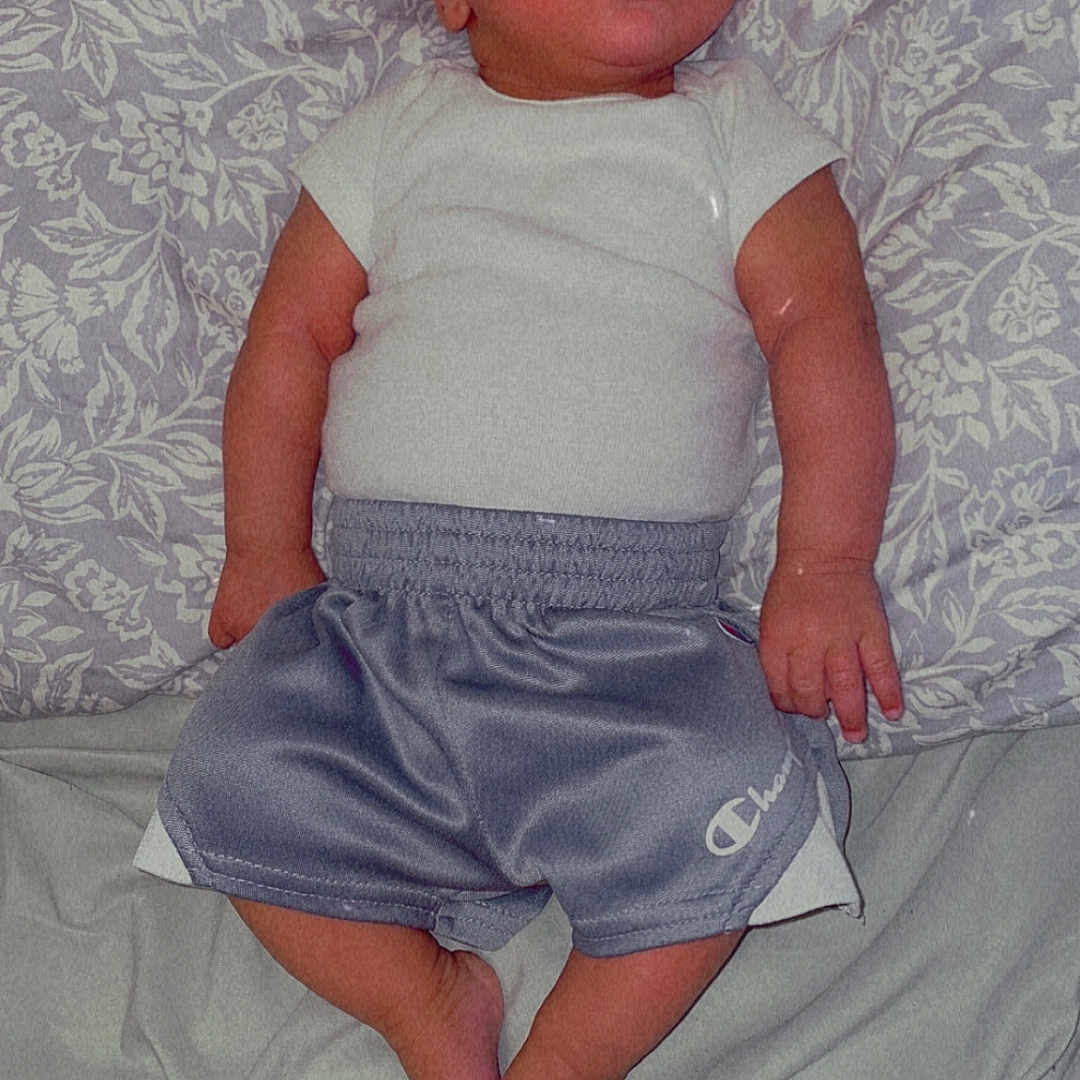 Micah joined the competition — help win amazing prizes! baby, bed, bedroom, clothing, couch, cushion, dress, face, furniture, head, homedecor, indoors, jeans, newborn, pants, person, photography, portrait, shorts, skirt