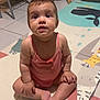 Alba participe au concours pour gagner de l'argent avec cette photo : animal_illustration, arms, baby, child, curious, cute, expression, face, floor, footwear_absent, furniture, home, indoors, legs, person, pink_clothing, play_mat, sitting, stool, tiles