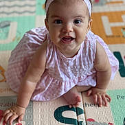 Alba a rejoint le concours — aidez-le/la à gagner de superbes lots ! baby, child, pink_dress, headband, crawling, play_mat, alphabet, indoor, happy, smiling, cute, infant, person, floor, hands, feet, young_child, portrait, closeup, colorful