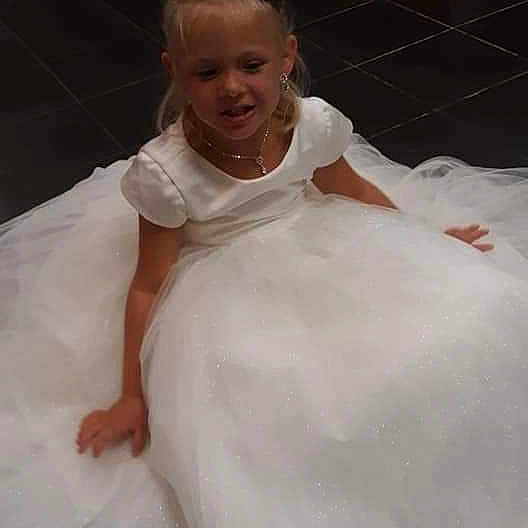 Teigan joined the competition — help win amazing prizes! bridal_clothing, child, dress, gown, person, smile, wedding_dress, white