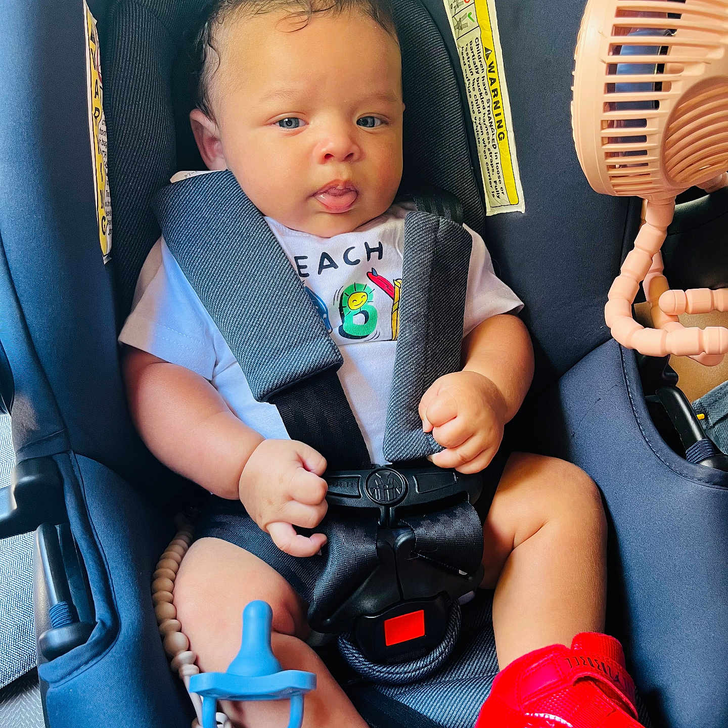 Elon joined the competition — help win amazing prizes! baby, car, car_interior, carseat, clothing, face, footwear, head, hockey, icehockey, icehockeystick, person, photography, portrait, rink, shoe, skating, sport, transportation, vehicle