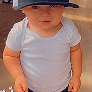 Lenox joined the competition — help win amazing prizes! athletic_clothing, baseball_cap, bengals, child, eyes, face, football, furniture, hands, heart_sticker, home, indoors, portrait, shorts, smiling, sports_fan, standing, toddler, white_shirt, wood_floor