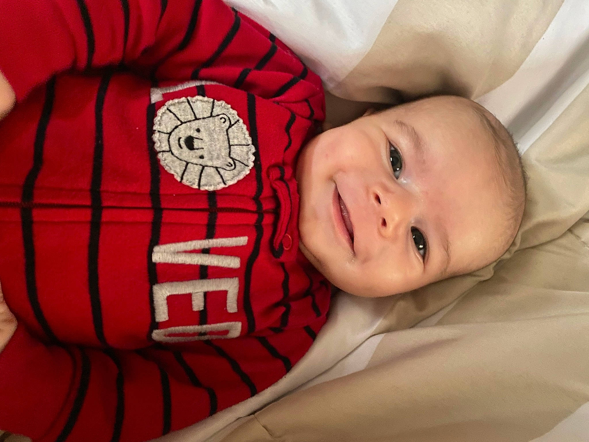 Julian joined the competition — help win amazing prizes! baby, baby_products, baby_toddler_clothing, carmine, comfort, fictional_character, happy, laugh, linens, pattern, person, pillow, plaid, portrait_photography, sleeve, smile, stuffed_toy, textile, toddler, toy