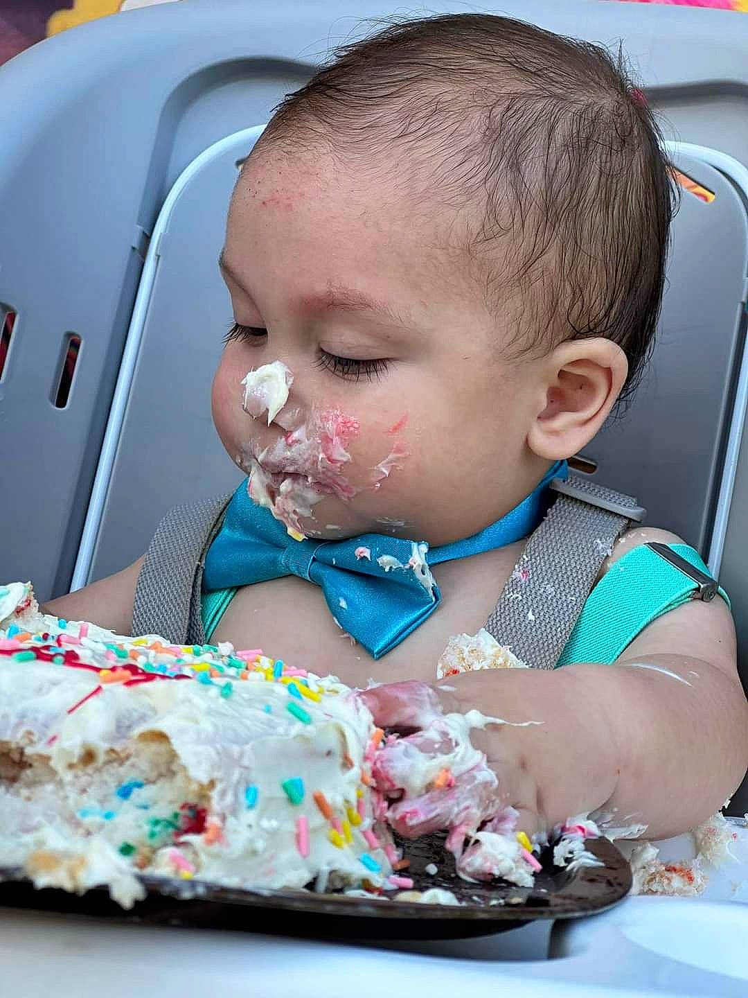 Hensley is registered to the contest to win money with this photo: baby, baby_toddler_clothing, baked_goods, birthday_cake, buttercream, cake, cake_decorating, cake_decorating_supply, chair, child, dessert, event, food, icing, person, plate, sugar_cake, sugar_paste, sweetness, tableware