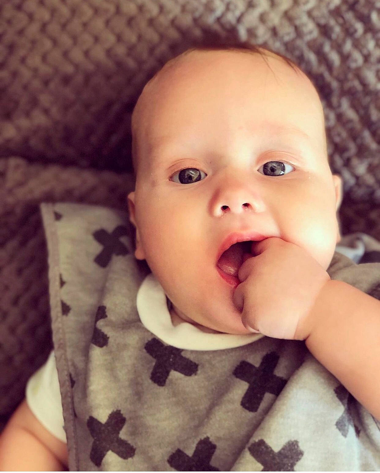 Ernie is registered to the contest to win money with this photo: baby, baby_making_funny_faces, beauty, cheek, child, chin, ear, electronic_device, eye, face, facial_expression, finger, happy, head, lip, mouth, nose, person, skin, smile