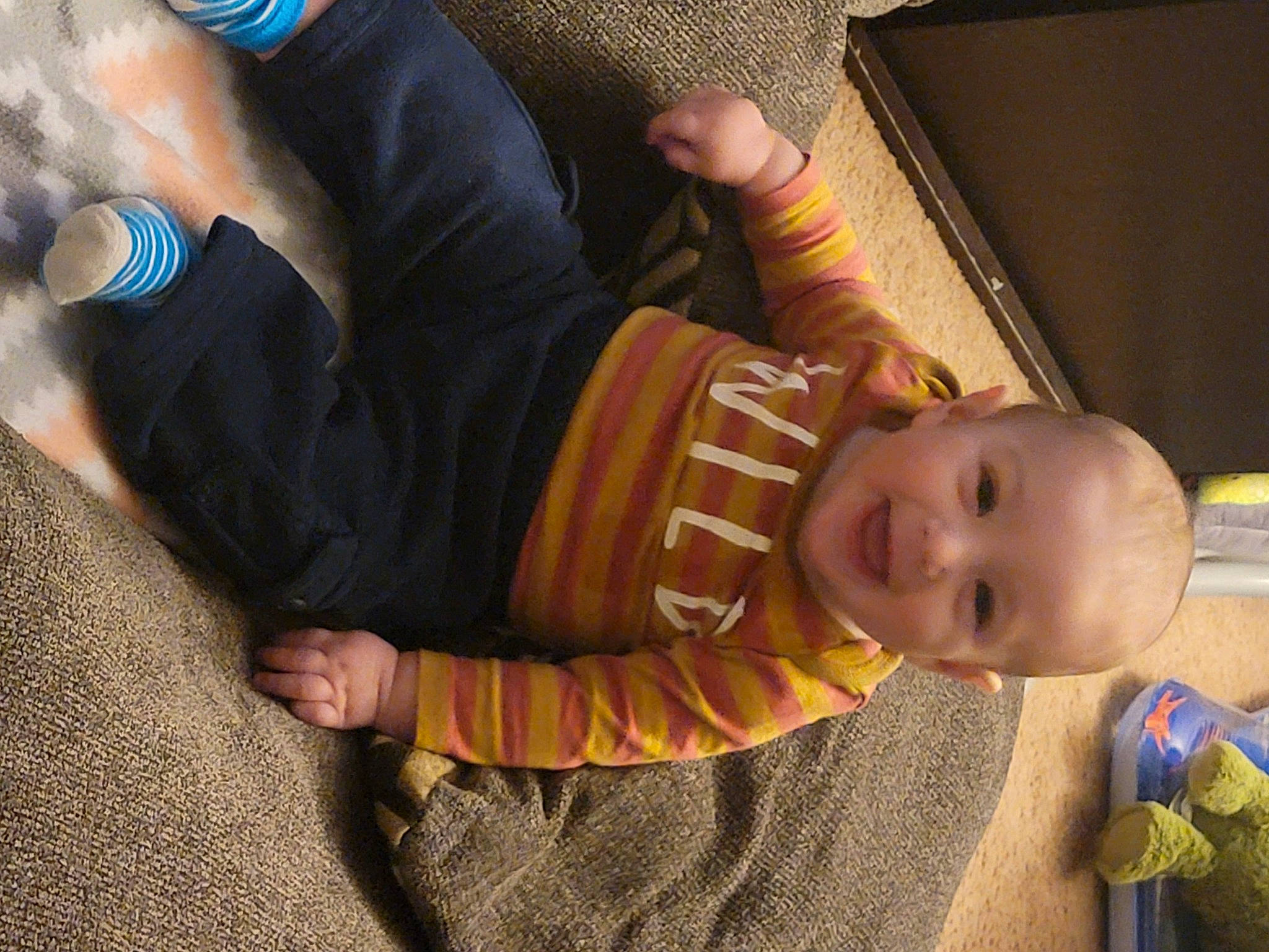 Bryson joined the competition — help win amazing prizes! baby, baby_toddler_clothing, bracelet, cheek, child, comfort, elbow, finger, flooring, fun, gesture, hand, human_leg, nail, person, sitting, thumb, toddler, watch, wood