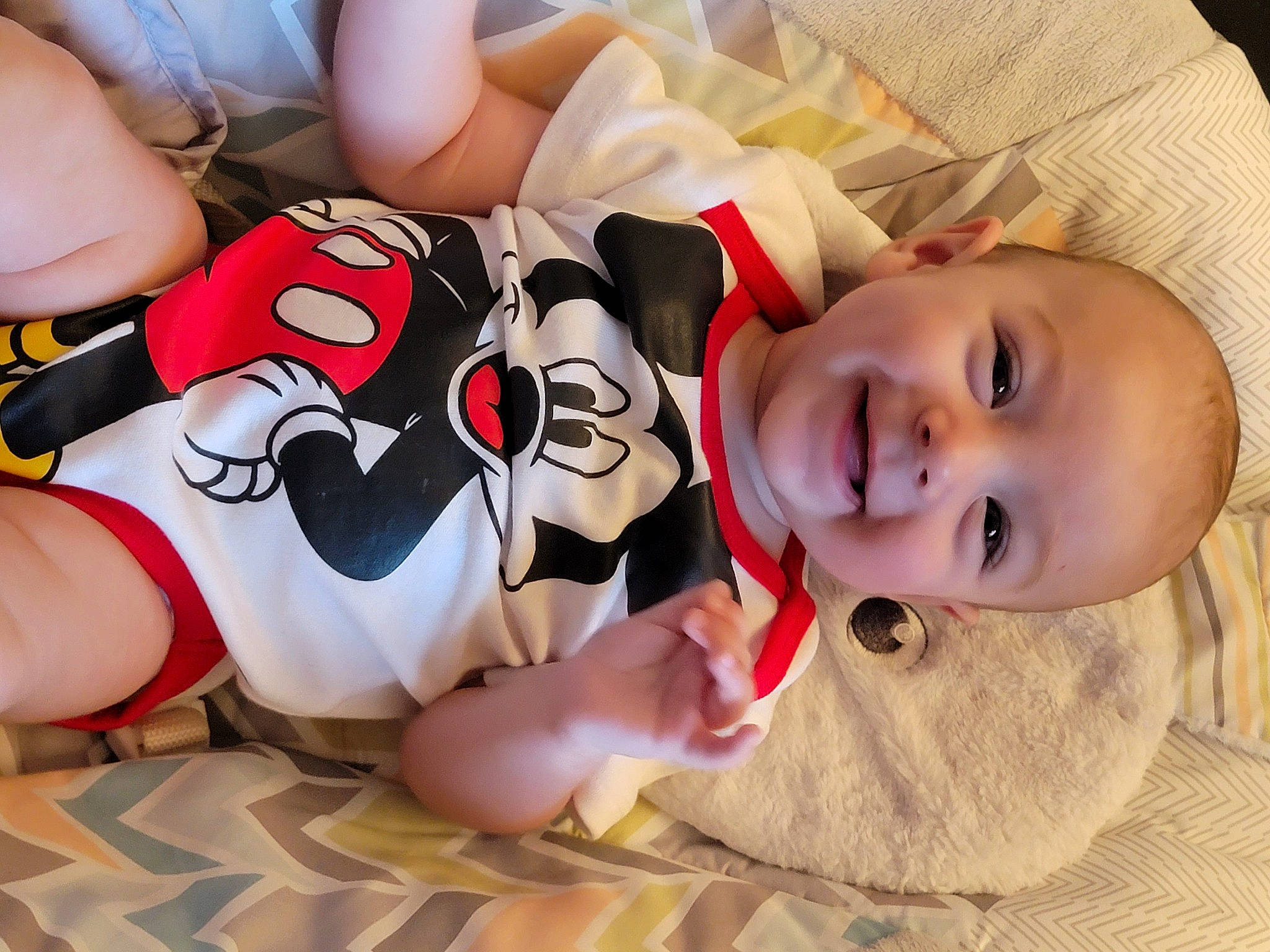 Bryson is registered to the contest to win money with this photo: baby, baby_toddler_clothing, carmine, child, comfort, flooring, fun, happy, head, human_body, human_leg, joy, knee, mouth, person, skin, smile, textile, thigh, toddler