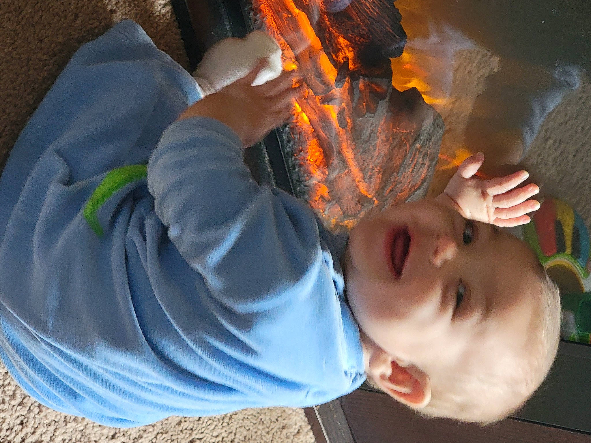 Bryson is registered to the contest to win money with this photo: baby, child, finger, fun, gesture, grass, happy, human_body, leaf, leisure, mouth, nose, orange, person, plant, play, toddler, tree, vegetable