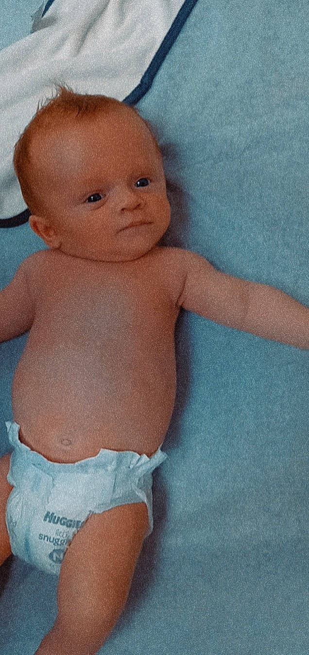 Lucian is registered to the contest to win money with this photo: arm, baby, cheek, chest, eye, hand, head, human_body, iris, joint, leg, lip, mouth, muscle, neck, nose, organ, person, skin, standing