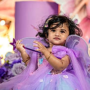 Aira joined the competition — help win amazing prizes! bracelet, celebration, child, costume, cute, decoration, fairy, fantasy, flower, girl, hair_clip, happy, indoors, magic_wand, party, portrait, purple_dress, smile, toddler, wings