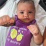Georgia is registered to the contest to win money with this photo: baby, infant, purple_onesie, lemon_graphics, pacifier, blanket, fist, cute, playful, lying_down, indoor, person, face, expression, clothing, child, skin, arm, hand, closeup