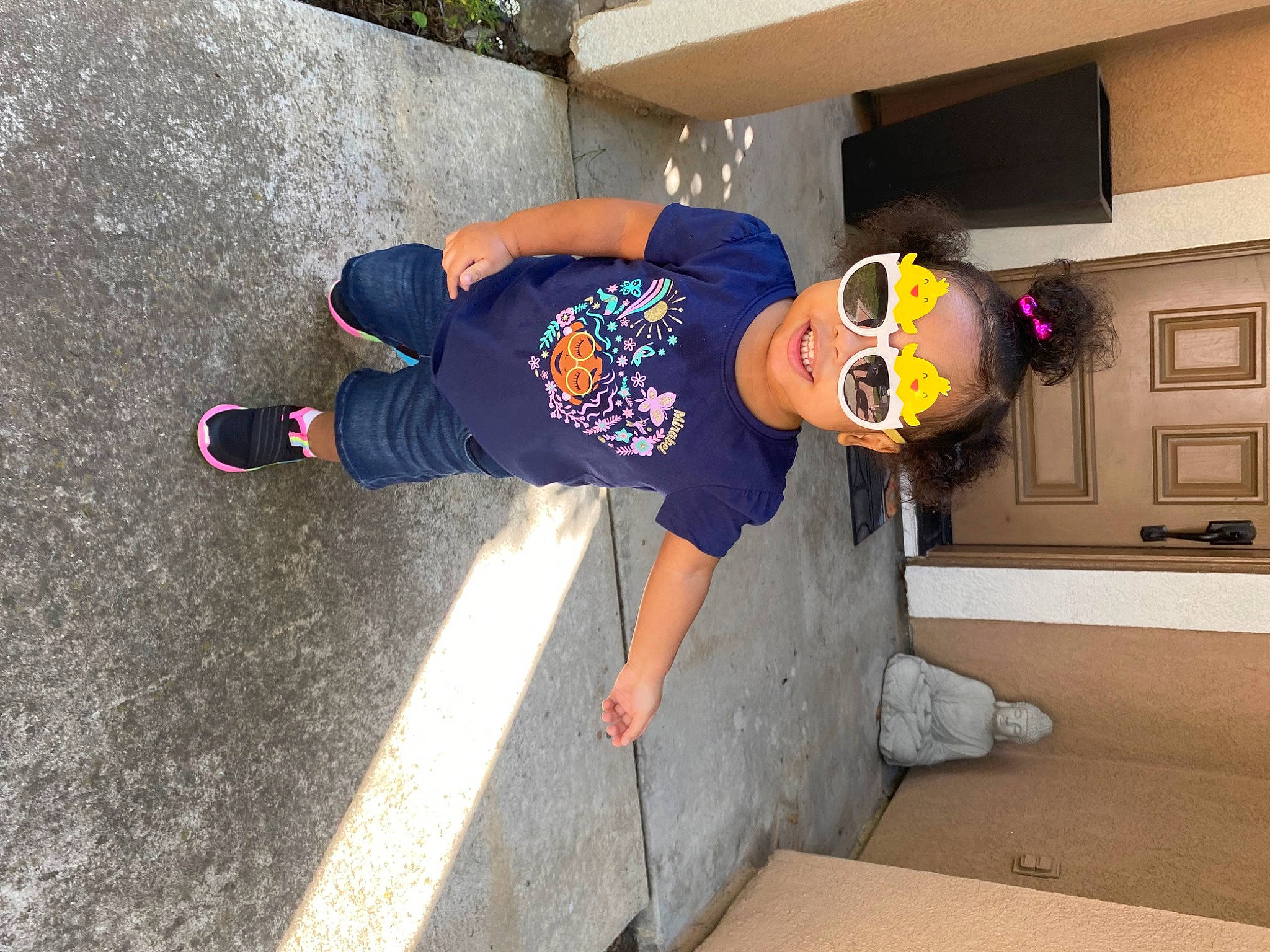 Justice joined the competition — help win amazing prizes! child, concrete, electric_blue, flooring, fun, hat, leisure, outdoor_shoe, person, personal_protective_equipment, plant, sidewalk, sneakers, sportswear, t_shirt, toddler, walking_shoe