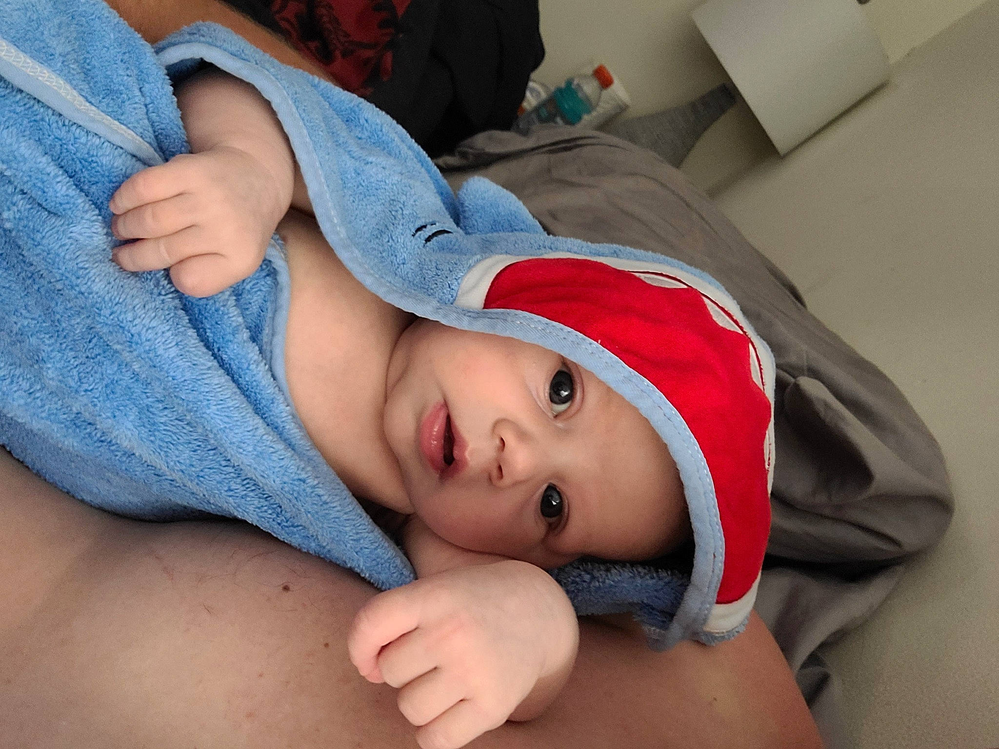 Julia is registered to the contest to win money with this photo: baby, cheek, chest, comfort, elbow, eyelash, finger, gesture, hand, happy, headwear, human_body, joint, lip, mouth, neck, nose, person, shoulder, skin