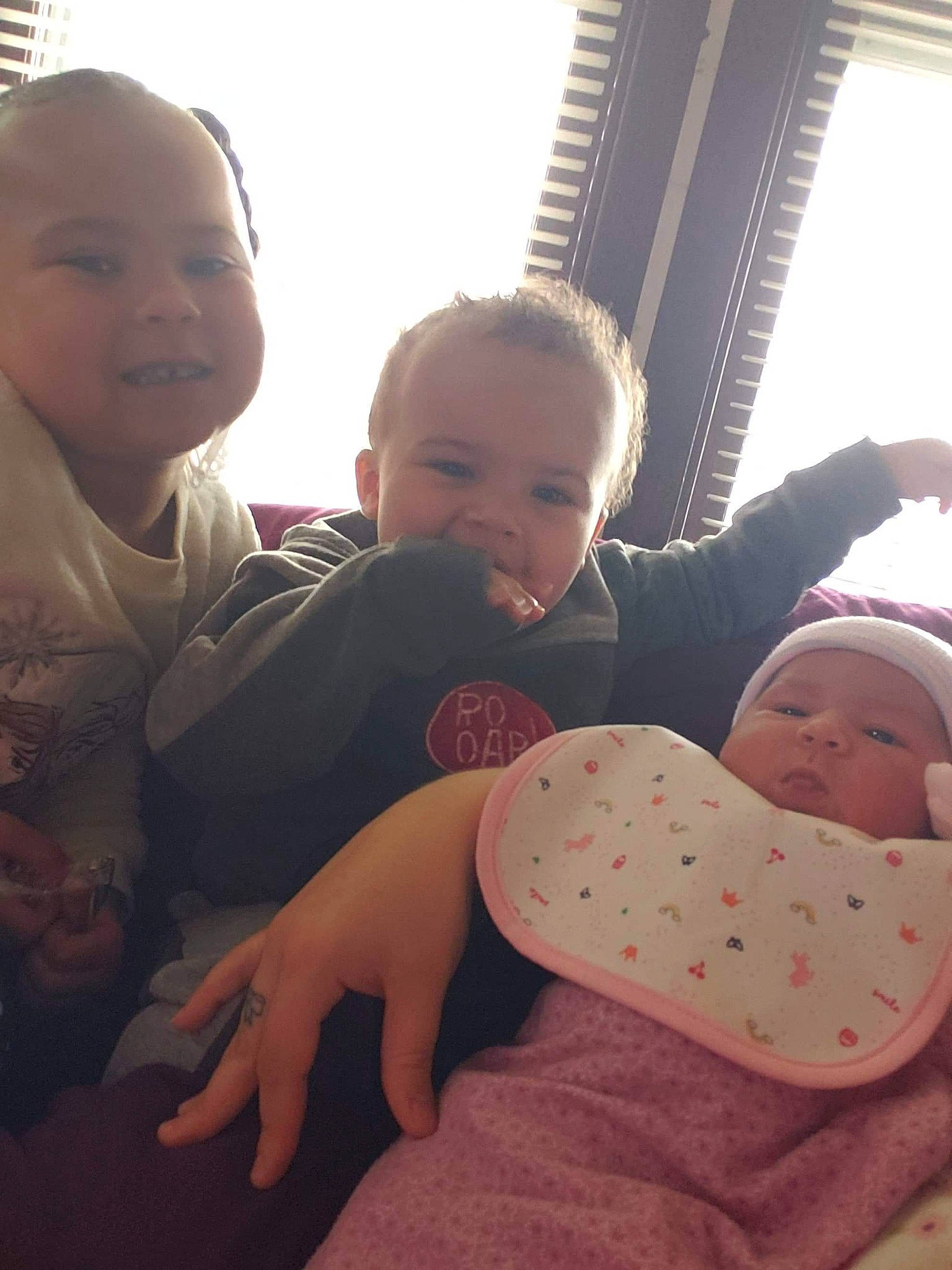 A'King is registered to the contest to win money with this photo: baby, cheek, child, daughter, ear, electronic_device, eye, face, family, happy, head, people, person, pink, product, sibling, sitting, skin, smile, toddler