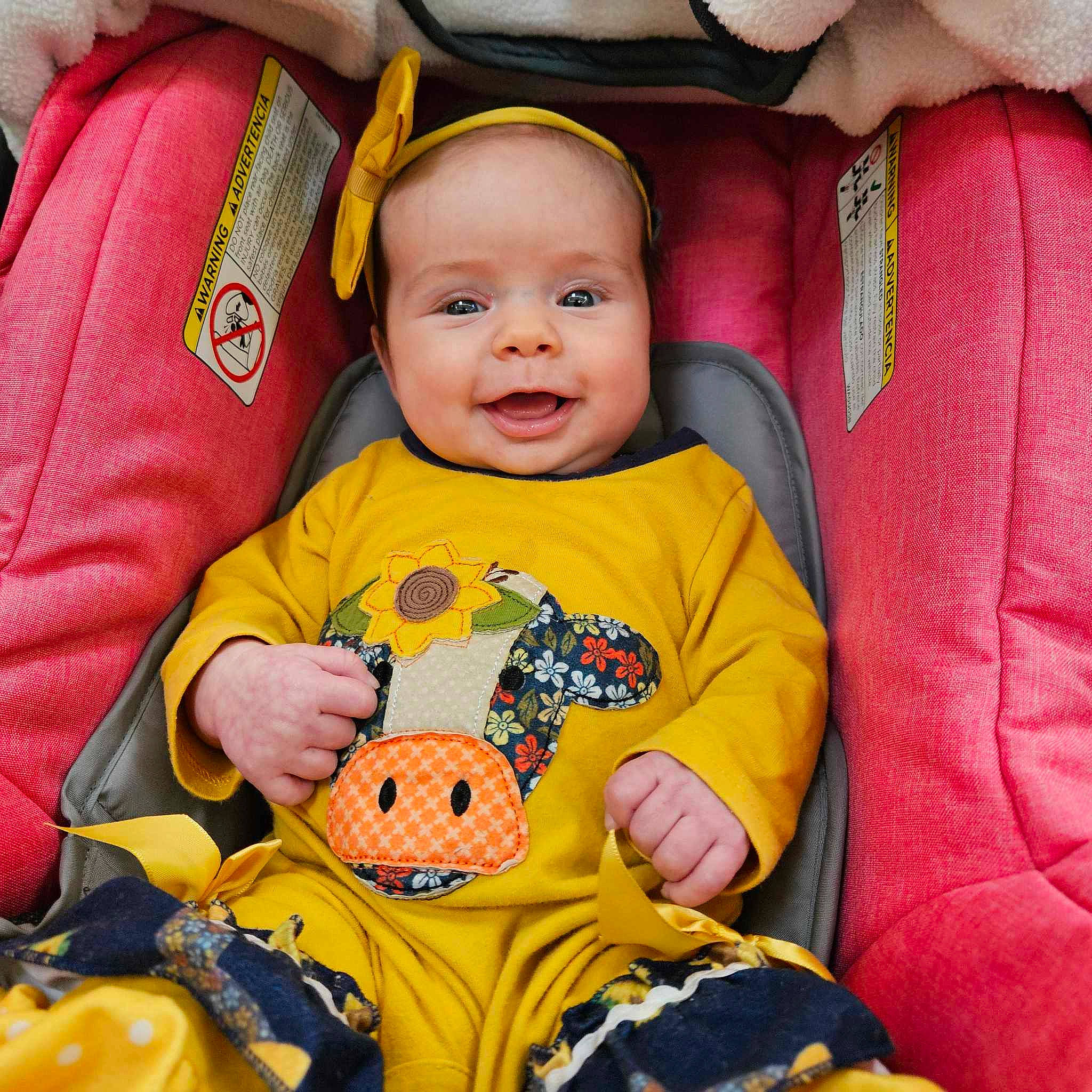 Kaleigh joined the competition — help win amazing prizes! baby, baby_toddler_clothing, cheek, comfort, eye, face, finger, happy, head, headgear, mammal, mouth, nose, orange, person, product, skin, sleeve, smile, textile