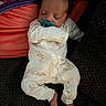baby, sleeping, pacifier, onesie, infant, child, cozy, cute, pattern, bear, foot, hand, face, resting, comfort, indoors, soft, blanket, person, newborn