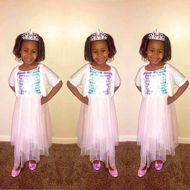 Patience is registered to the contest to win money with this photo: child, child_model, clothing, costume, dress, event, hair_accessory, headpiece, headwear, joy, person, toddler