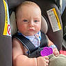 River joined the competition — help win amazing prizes! baby, car_seat, child, blue_eyes, teething_toy, infant, straps, serious_expression, seatbelt, toy, hand, clothing, safety, portrait, indoors, closeup, person, cute, young_child, travel