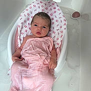 Isla joined the competition — help win amazing prizes! baby, newborn, bath, bathtub, water, pink_cloth, baby_bath_seat, hand, elephant_cup, foam, skin, infant, child, cute, wrapped, relaxing, indoors, care, parenting, cleaning