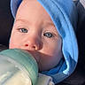 Thomas joined the competition — help win amazing prizes! baby, bottle, milk, blue_hood, close_up, infant, child, face, feeding, milk_bottle, cute, young_child, portrait, light, skin, expression, clothing, seat, car_seat, peaceful
