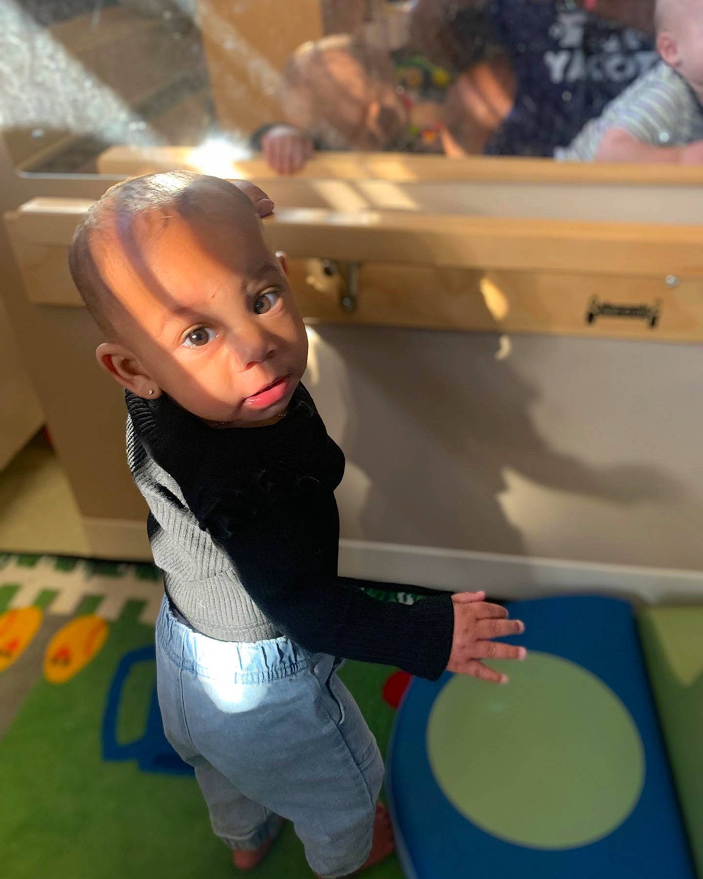 Asata is registered to the contest to win money with this photo: arm, baby, child, drum, event, flooring, fun, games, happy, leisure, person, photograph, recreation, room, shorts, sitting, snapshot, standing, t_shirt, toddler