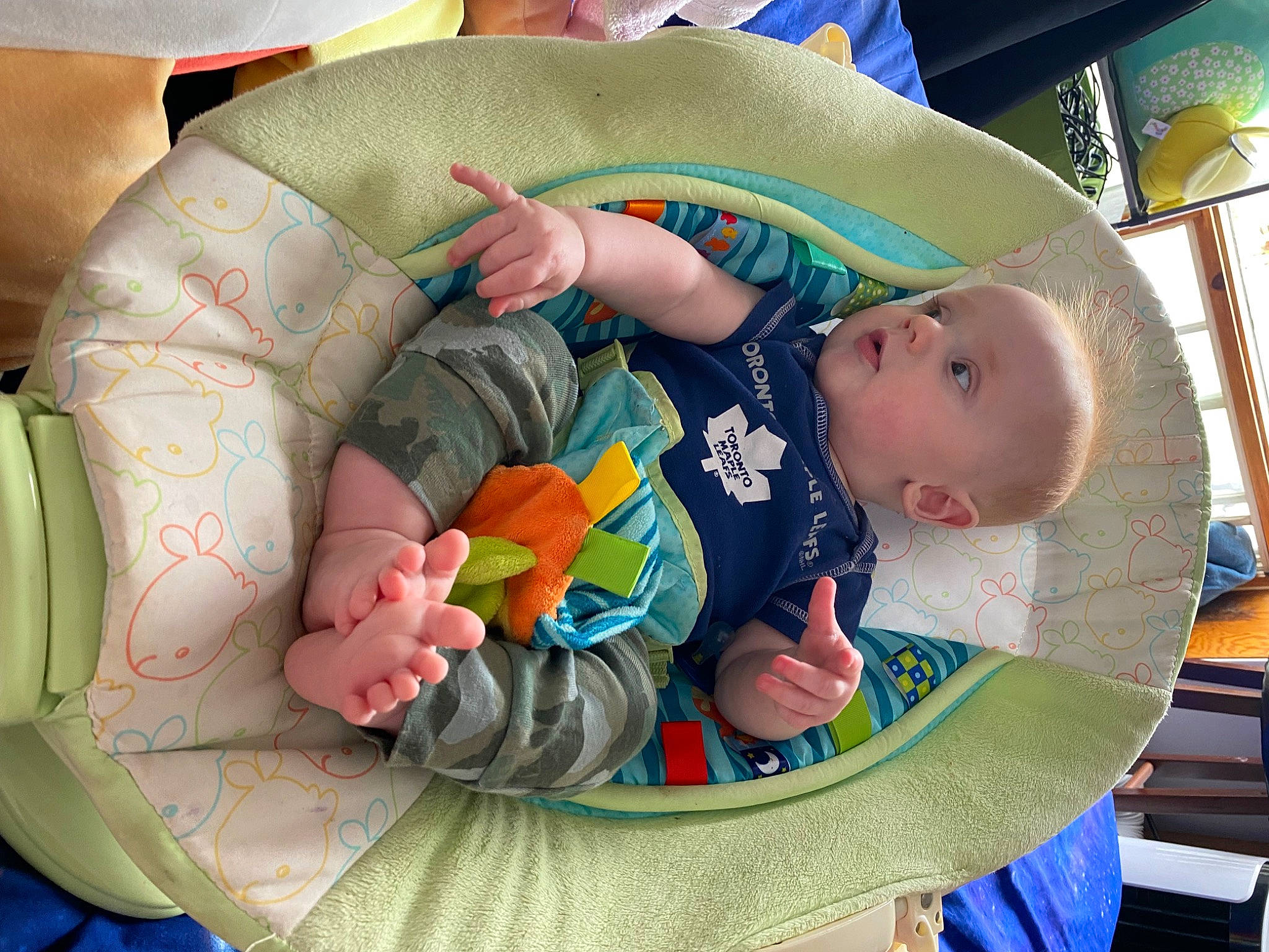 Auston is registered to the contest to win money with this photo: baby, baby_carriage, baby_products, baby_safety, baby_sleeping, baby_toddler_clothing, baby_toys, child, circle, comfort, green, linens, pattern, person, play, room, sitting, toddler, toy