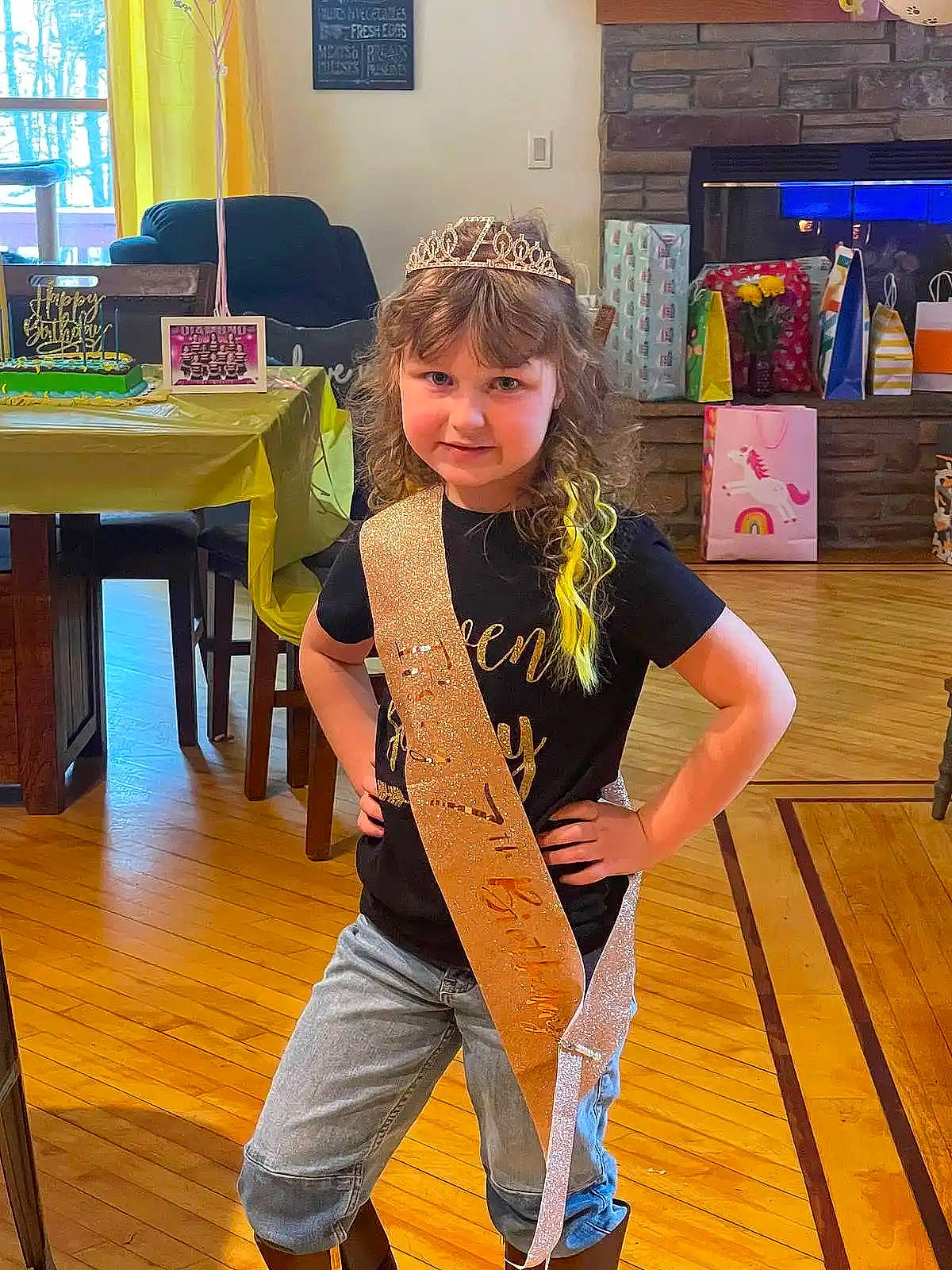 Nevada is registered to the contest to win money with this photo: child, event, fashion_design, floor, flooring, fun, happy, hardwood, human_leg, joy, laminate_flooring, leisure, person, room, sitting, standing, table, toddler, varnish, wood