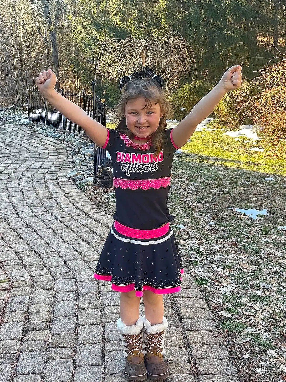 Nevada is registered to the contest to win money with this photo: asphalt, electric_blue, event, fun, gesture, grass, happy, joy, leisure, magenta, pattern, people_in_nature, person, recreation, shoulder, sleeve, smile, t_shirt, toddler, tree