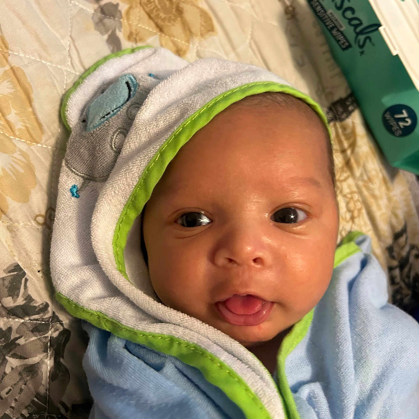 Kyle Jr is registered to the contest to win money with this photo: baby, babylaughing, blanket, bonnet, clothing, coat, face, happy, hat, head, hood, hoodie, knitwear, newborn, person, photography, portrait, smile, sweater, sweatshirt