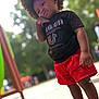 Messiah joined the competition — help win amazing prizes! afro_hair, black_tshirt, casual_wear, child, cute, daylight, greenery, nature, outdoor, park, pensive, person, portrait, posing, red_shorts, soft_background, standing, summer_clothing, toddler, young_child