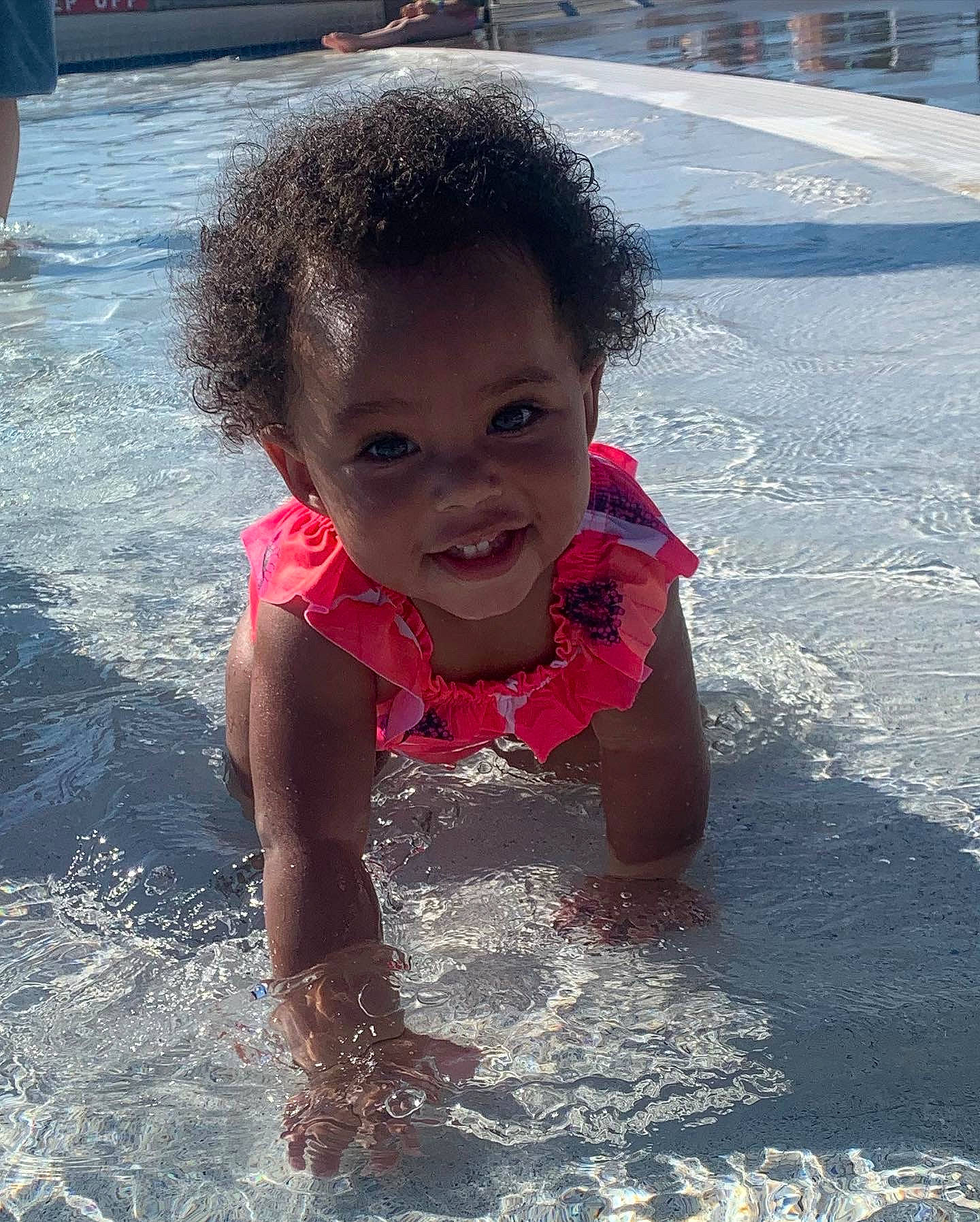 Bonnie is registered to the contest to win money with this photo: bathing, chest, child, fun, happy, head, joy, leisure, nonbuilding_structure, ocean, people_on_beach, person, personal_protective_equipment, play, recreation, sand, smile, toddler, vacation, water