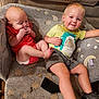 baby, blanket, casual, child, clothing, couch, fabric, face, footwear, furniture, hand, happy, home, indoor, leg, pattern, sitting, smile, toddler, toy