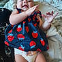 Maja joined the competition — help win amazing prizes! baby, blanket, child, clothing, cute, diaper, dress, fabric, face, hand, happy, indoors, infant, lying_down, pattern, person, skin, smiling, strawberry_pattern, young