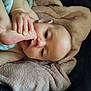 Maja joined the competition — help win amazing prizes! baby, infant, foot, hand, blanket, soft_texture, skin, cute, lying_down, closeup, face, child, mouth, nibbling, relaxation, indoors, expression, curious, human, toddler