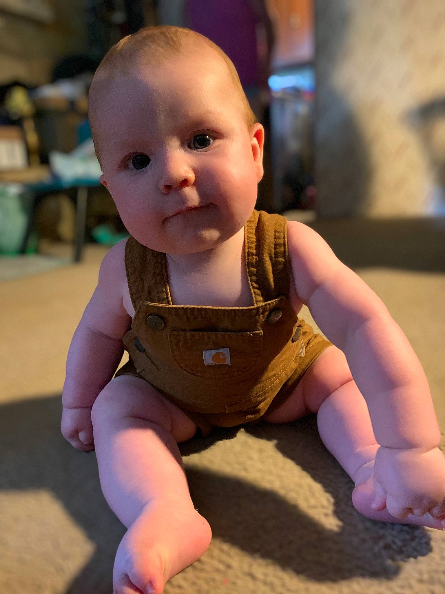 William is registered to the contest to win money with this photo: baby, baby_toddler_clothing, cheek, chin, crawling, eye, finger, floor, flooring, fun, happy, human_body, iris, joint, knee, person, skin, sleeve, thumb, toddler