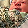 Sterling joined the competition — help win amazing prizes! newborn, baby, infant, child, face, portrait, close_up, knit_hat, blanket, bundled, cozy, indoors, sleepy, squinting, eyes, nose, mouth, warm_clothing, soft_texture, family_photo