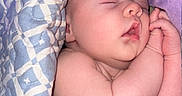 Sterling joined the competition — help win amazing prizes! baby, newborn, sleeping, infant, portrait, peaceful, bed, blanket, pillow, quilt, indoors, resting, curled_up, hand, face, closed_eyes, bedding, cozy, nap, child