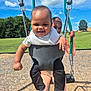 baby, child, swing, playground, park, grass, trees, sky, clouds, sunny, smile, happy, outdoor, fun, play, person, clothing, footwear, toy, nature
