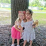 child, children, doll, dress, footwear, friendship, girl, girls, grass, happy, headband, leaves, nature, outdoor, playful, sandals, smile, sunlight, tree, young