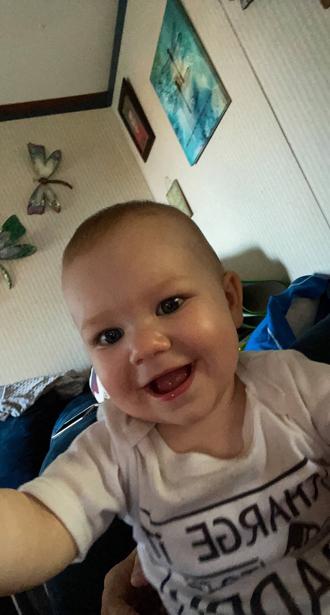 Arya is registered to the contest to win money with this photo: arm, baby, baby_toddler_clothing, blue, cheek, eye, eyebrow, forehead, happy, iris, jaw, joy, lip, mouth, nose, person, picture_frame, skin, sleeve, smile