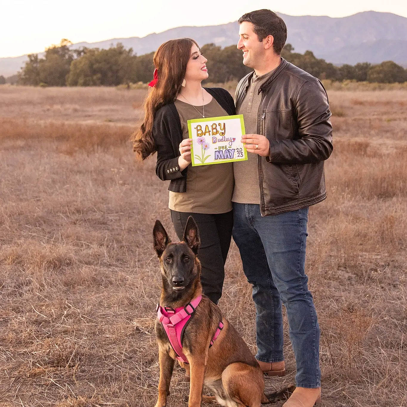 Nyla joined the competition — help win amazing prizes! carnivore, companion_dog, dog, dog_breed, fawn, fun, gesture, grass, grassland, happy, jeans, landscape, people_in_nature, photograph, plant, recreation, sky, smile, tree, working_animal