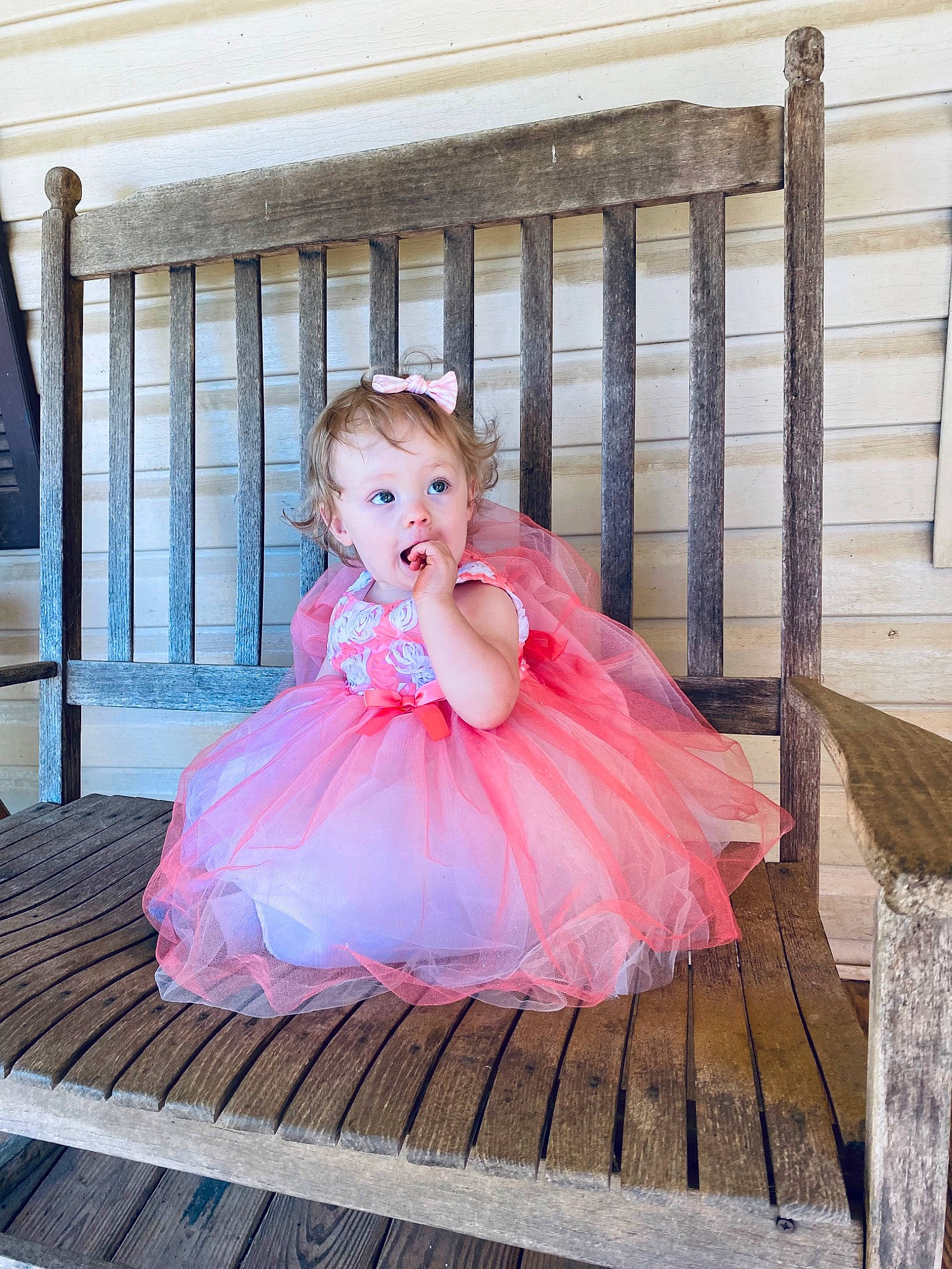 Aryanna is registered to the contest to win money with this photo: baby_toddler_clothing, bridal_party_dress, child, day_dress, dress, embellishment, event, fashion_design, flash_photography, formal_wear, gown, happy, headpiece, hoopskirt, magenta, person, pink, ruffle, sitting, surprise