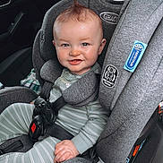 Josiah joined the competition — help win amazing prizes! baby, car_seat, child, smiling, mohawk, seatbelt, gray, striped_clothing, infant, safety, car_interior, cute, happy, person, young_child, portrait, seat, baby_clothes, hands, headrest