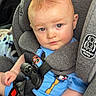 Josiah is registered to the contest to win money with this photo: baby, child, car_seat, blue_outfit, mohawk_hairstyle, straps, safety, infant, cute, portrait, car_interior, seatbelt, child_safety, looking, headrest, casual_clothing, skin, hand, face, young_child